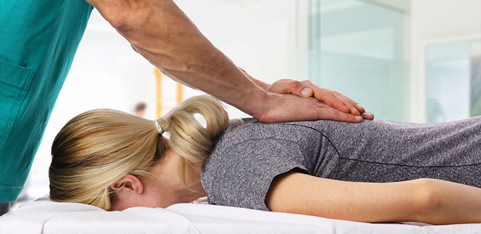 Patient receiving Diversified Technique in Oakland for pain relief