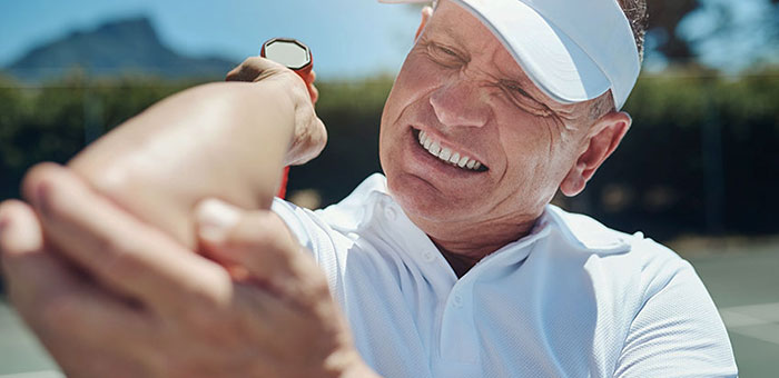 Patient suffering from Tennis Elbow in need of chiropractor in Oakland